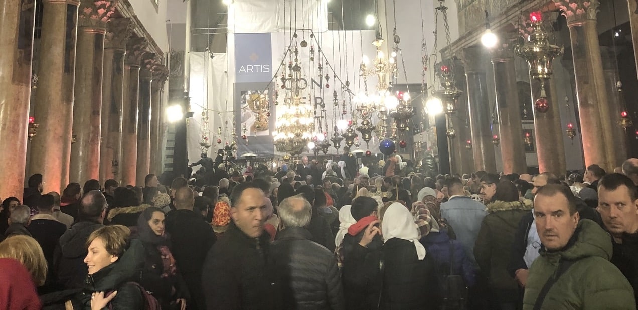 Christians gathered in the Church of the Nativity, Bethlehem on Christmas Eve